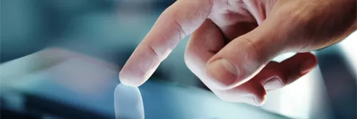 Photo of hand using a touchscreen