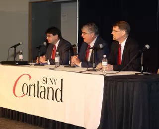 Ambassador Jeffrey Davidow participates in a panel discussion on Cuba with Miguel Fraga, First Secretary at the Embassy of Cuba in the U.S., and Mark Wells, Director of the Office of Cuban Affairs at the US Department of State.